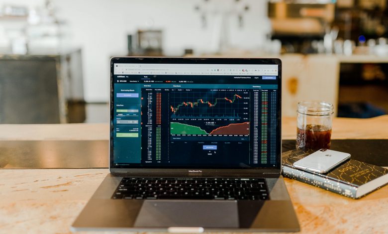 photo showing a stock market chart on a laptop