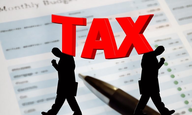 An illustration of tax and silhouette of two men